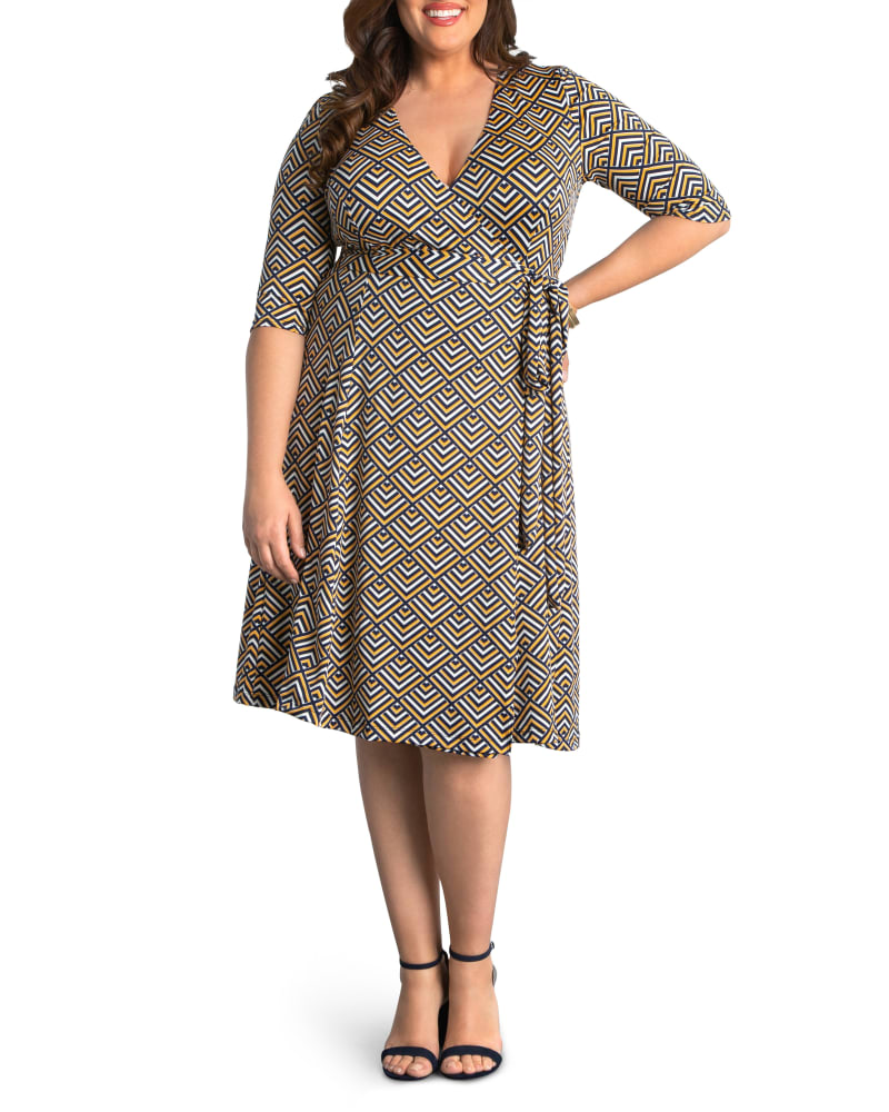 Front of a model wearing a size 0X Essential Wrap Dress in GOLDEN GEOMETRIC PRINT by Kiyonna. | dia_product_style_image_id:279168